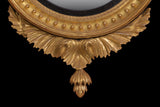 AN EXCEPTIONAL REGENCY CARVED GILTWOOD CONVEX MIRROR - REF No. 6011